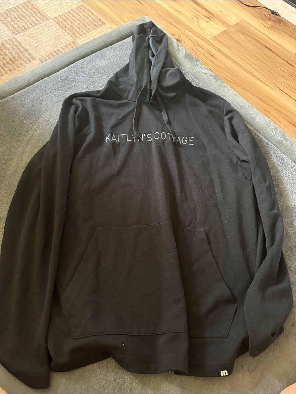 Travis Mathew Black Hoodie with White Chest Script